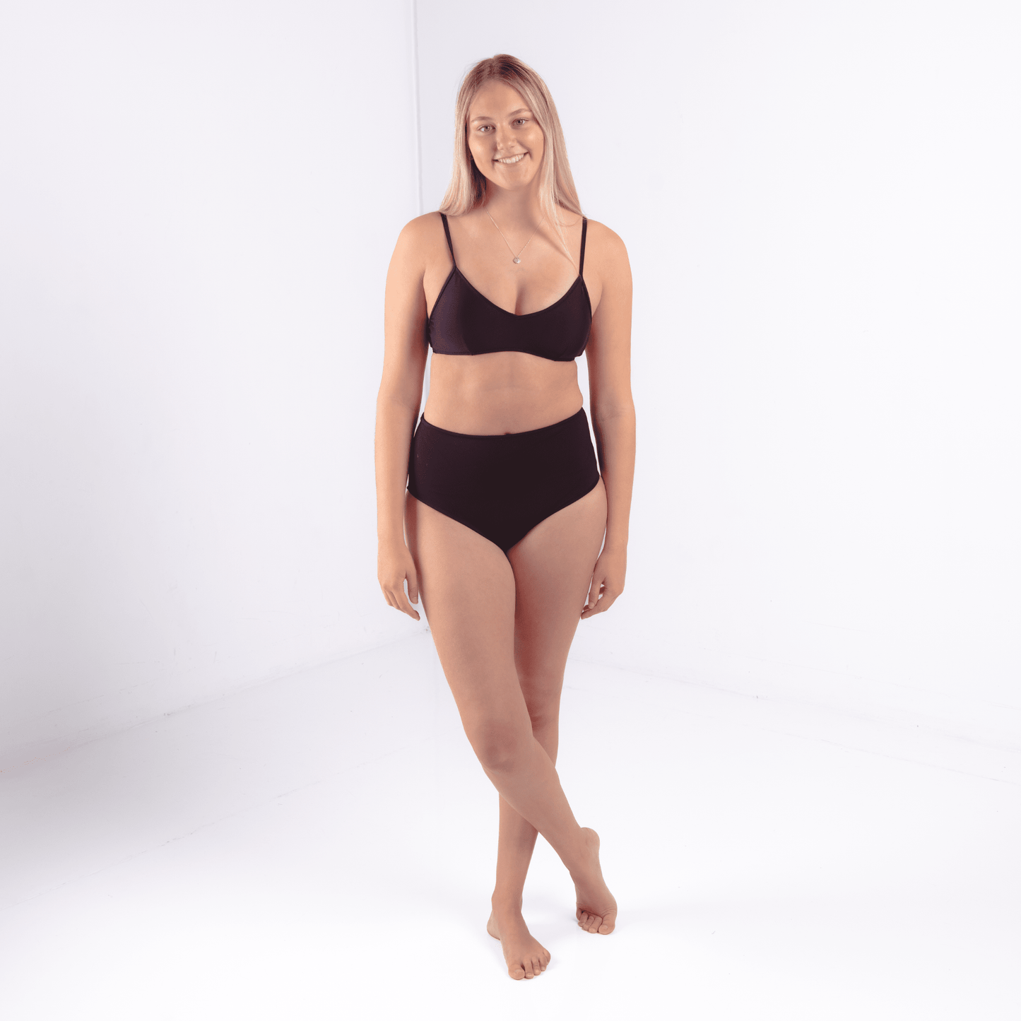 Teen wearing ultra high waist period-proof swimwear at the beach
